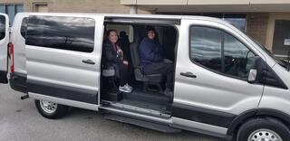 Rise students in a van